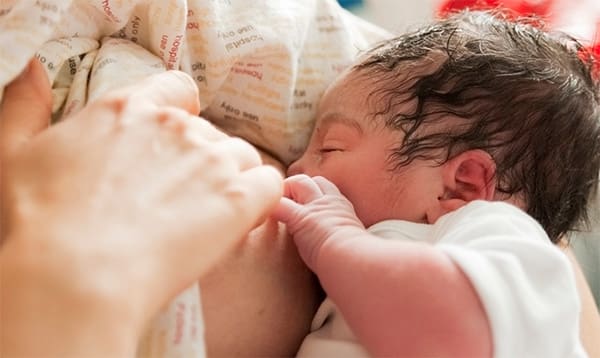 baby breastfeeding in the hospital