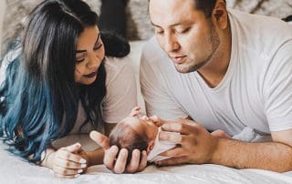 mom and dad with newborns first day home