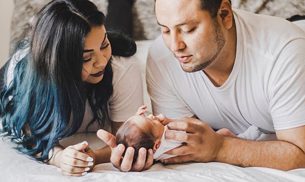mom and dad with newborns first day home