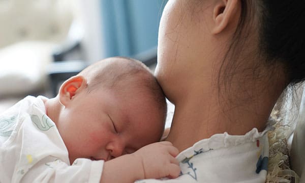 new mother bonding with baby