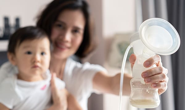 mother is increasing milk by pumping
