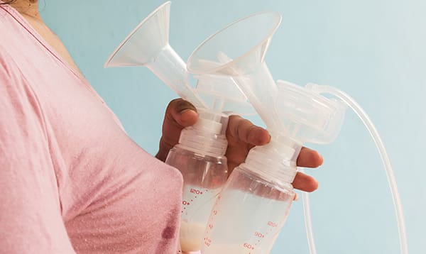 woman wondering about breast pumps and scales