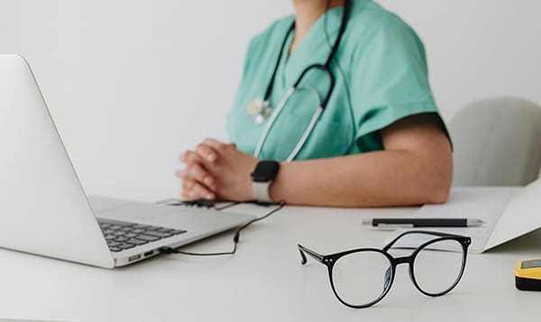 should you see a lactation consultant or doctor- doctor at desk