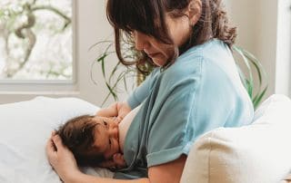 Woman breastfeeding her baby - planning for baby feeding