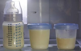 three containers of mother's milk hand expressed