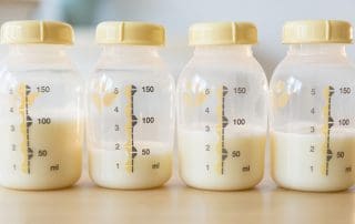 half filled bottles of high lipase milk