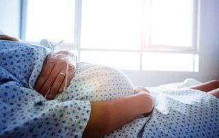 image of pregnant woman in hospital waiting to deliver a baby with induction