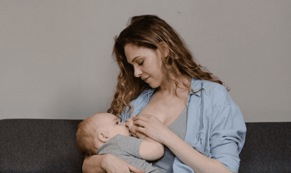 Breastfeeding an infant.