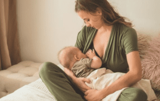 Mother breastfeeding her baby, showing cluster feeding.