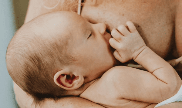 Baby being breastfed.