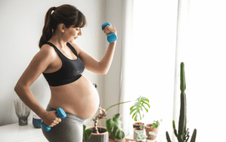 Pregnant women exercising at home