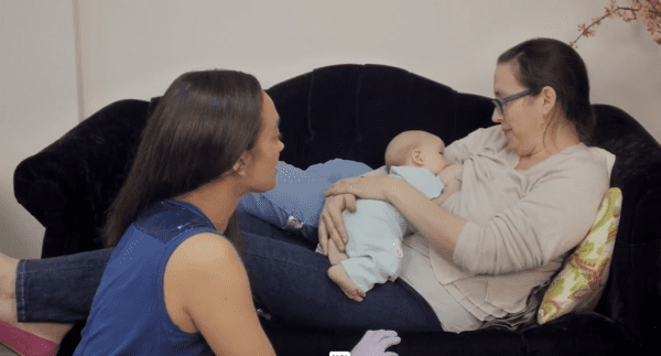 Breastfeeding Success' IBCLC helping a new mom with the laid back breastfeeding position