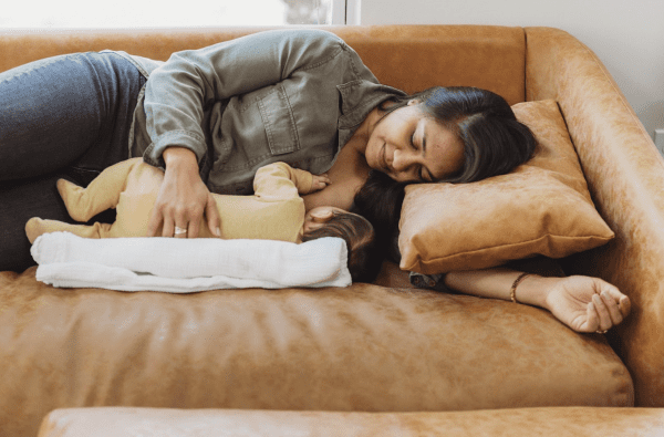 Breastfeeding Success' IBCLC helping a new mom with the side-lying breastfeeding position